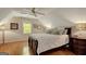 Bedroom with hardwood floors, pitched ceiling, a ceiling fan and natural light from a window at 140 Horton Creek Trl, Brooks, GA 30205