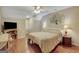 Bedroom with a slanted ceiling, a decorative tree on the wall and bedside tables at 140 Horton Creek Trl, Brooks, GA 30205