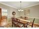 Formal dining room with a decorative table and chairs, chandelier, and access to the kitchen at 140 Horton Creek Trl, Brooks, GA 30205