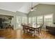 Bright dining room features hardwood floors, large windows, and adjacent living area at 140 Horton Creek Trl, Brooks, GA 30205