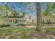 Charming two-story home with a welcoming front porch and lush green lawn at 140 Horton Creek Trl, Brooks, GA 30205