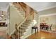 Welcoming foyer with staircase leading to the second floor, adjacent to the dining and living rooms at 140 Horton Creek Trl, Brooks, GA 30205