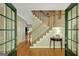 Elegant foyer with hardwood floors and staircase, featuring natural light at 140 Horton Creek Trl, Brooks, GA 30205