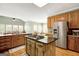 Spacious kitchen with stainless appliances and island with gas cooktop at 140 Horton Creek Trl, Brooks, GA 30205