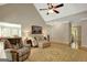 Cozy living room with comfortable seating, a vaulted ceiling, and hardwood floors at 140 Horton Creek Trl, Brooks, GA 30205