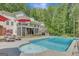 Inviting backyard pool with waterfall feature, surrounded by lounge chairs and lush greenery at 140 Horton Creek Trl, Brooks, GA 30205