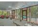 Screened porch with a seating and dining area offering views of the pool and backyard at 140 Horton Creek Trl, Brooks, GA 30205