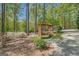 Wooden swing on a manicured lawn in a scenic yard surrounded by trees at 140 Horton Creek Trl, Brooks, GA 30205