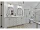 Elegant bathroom with double sinks, marble counters, and a glass enclosed shower at 308 Summer Pl, Peachtree City, GA 30269