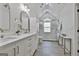 Bright bathroom with double sinks, white cabinets, and modern finishes at 308 Summer Pl, Peachtree City, GA 30269