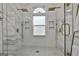 Elegant bathroom featuring a spacious glass shower with dual shower heads and stylish tile work at 308 Summer Pl, Peachtree City, GA 30269