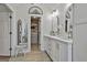 Bright bathroom with double sink vanity and walk-in closet, offering plenty of storage at 308 Summer Pl, Peachtree City, GA 30269