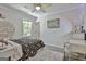Stylish bedroom with carpet floor, soft lighting, and a comfortable bed at 308 Summer Pl, Peachtree City, GA 30269