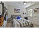 Comfortable bedroom with carpet floor, a bed, and a desk, providing a cozy retreat at 308 Summer Pl, Peachtree City, GA 30269