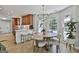 Cozy dining area adjacent to kitchen with wood table, seating for four, and natural light at 308 Summer Pl, Peachtree City, GA 30269