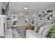 Inviting living room showcasing a fireplace, large windows, and contemporary furnishings at 308 Summer Pl, Peachtree City, GA 30269