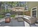 Outdoor patio area with wicker seating, patio umbrella, and grill offers a relaxing space for entertaining at 308 Summer Pl, Peachtree City, GA 30269