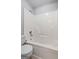 Bathroom featuring a white tub and toilet for convenience at 5882 Trent Walk Dr, Lithonia, GA 30038