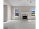 Inviting living room with a marble fireplace and light-filled windows at 5882 Trent Walk Dr, Lithonia, GA 30038
