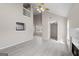 Living area features vaulted ceiling, fireplace, and view into adjacent kitchen and loft at 5882 Trent Walk Dr, Lithonia, GA 30038