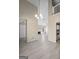 Bright living space with high ceilings, fireplace, and views into the kitchen at 5882 Trent Walk Dr, Lithonia, GA 30038