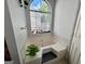 Bright bathroom highlighting an oversized tub with jets and an arched window bringing in natural light at 403 Rock Creek Dr, Peachtree City, GA 30269