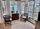 Cozy breakfast nook surrounded by windows, offering ample natural light and comfortable seating at 403 Rock Creek Dr, Peachtree City, GA 30269