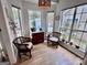 Cozy breakfast nook surrounded by windows, offering ample natural light and comfortable seating at 403 Rock Creek Dr, Peachtree City, GA 30269