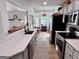 Bright kitchen featuring stainless steel appliances, spacious countertops, and an open layout at 403 Rock Creek Dr, Peachtree City, GA 30269