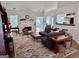 Bright living room with a cozy fireplace, modern furnishings, and access to outdoor spaces at 403 Rock Creek Dr, Peachtree City, GA 30269