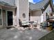 Outdoor patio space with seating area perfect for relaxation and enjoying the backyard views at 403 Rock Creek Dr, Peachtree City, GA 30269
