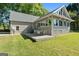 Backyard featuring a wooden deck with outdoor seating at 423 Bear Creek Trl, Hampton, GA 30228