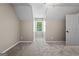 Bright bedroom with a window offering natural light, complemented by soft carpeting and freshly painted walls at 423 Bear Creek Trl, Hampton, GA 30228