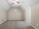 Spacious bedroom with plush carpeting, neutral walls, and a ceiling fan, creating a comfortable and relaxing atmosphere at 423 Bear Creek Trl, Hampton, GA 30228