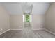 Spacious bedroom featuring plush carpet and a bright window at 423 Bear Creek Trl, Hampton, GA 30228