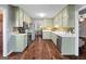 Charming kitchen with ample cabinetry, stainless steel appliances, and backsplash, flowing into dining area at 423 Bear Creek Trl, Hampton, GA 30228