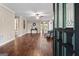 Open living room with hardwood floors, ceiling fan, and elegant decor, showcasing a bright space at 423 Bear Creek Trl, Hampton, GA 30228