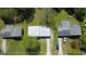 Aerial view of a neighborhood with a gray roof and well-maintained lawns, showcases the home's location at 2571 Stanford Dr, Ellenwood, GA 30294