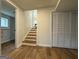 View of the basement with wood floors, closet, and staircase to the main level at 2571 Stanford Dr, Ellenwood, GA 30294