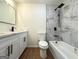 Modern bathroom featuring a double vanity, a shower-over-tub with tiled walls, and updated fixtures at 2571 Stanford Dr, Ellenwood, GA 30294