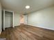 Bright bedroom with closet and hardwood floors, neutral walls, and a window providing natural light at 2571 Stanford Dr, Ellenwood, GA 30294