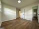 A spacious bedroom with wood flooring and natural light at 2571 Stanford Dr, Ellenwood, GA 30294