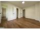 A bright, airy bedroom with wood floors, neutral walls, and ample closet space at 2571 Stanford Dr, Ellenwood, GA 30294