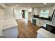 Modern kitchen boasts white cabinets, stainless steel appliances, and sleek countertops, perfect for culinary enthusiasts and entertaining at 2571 Stanford Dr, Ellenwood, GA 30294