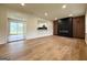 Spacious living room features a modern fireplace, wood floors, and abundant natural light, creating a welcoming atmosphere at 2571 Stanford Dr, Ellenwood, GA 30294