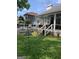 Back porch featuring outdoor seating, white railings, and a view of the backyard and pool at 187 Pine Branch Dr, Stockbridge, GA 30281