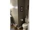 Comfortable half bath features a toilet, stylish fixtures, and warm neutral tones at 187 Pine Branch Dr, Stockbridge, GA 30281