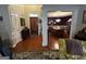 Inviting foyer with hardwood floors leads into the dining room with a table set for a meal at 187 Pine Branch Dr, Stockbridge, GA 30281