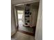 Hallway with hardwood floors and built-in shelving leading to a bedroom at 187 Pine Branch Dr, Stockbridge, GA 30281