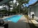 Inviting backyard pool with a wooden deck and a view of the surrounding greenery at 187 Pine Branch Dr, Stockbridge, GA 30281